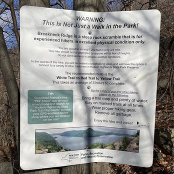 Breakneck Ridge - A sign provides safety instructions and trail information for hikers at Breakneck Ridge, highlighting its steep terrain and scenic views. - Hiking Near Me - Cold Spring, New York