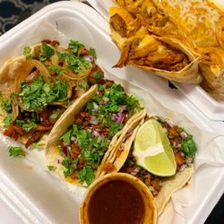 2 Brothers Tacos - Chorizo and al pastor tacos with a pork quesadilla