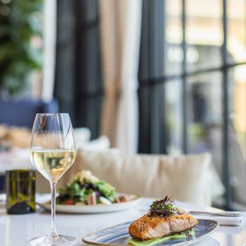 Bacchus Kitchen + Bar - a plate of food and a glass of wine - American Near Me - Grapevine, Texas
