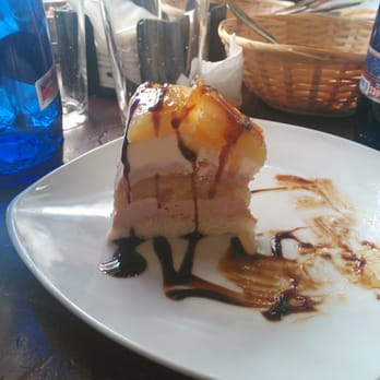 Taberna Águilas - A "cake" comprised of different layers of mousse and cream, with a vinaigrette dressing. - Tapas Bars Near Me - Seville, SE