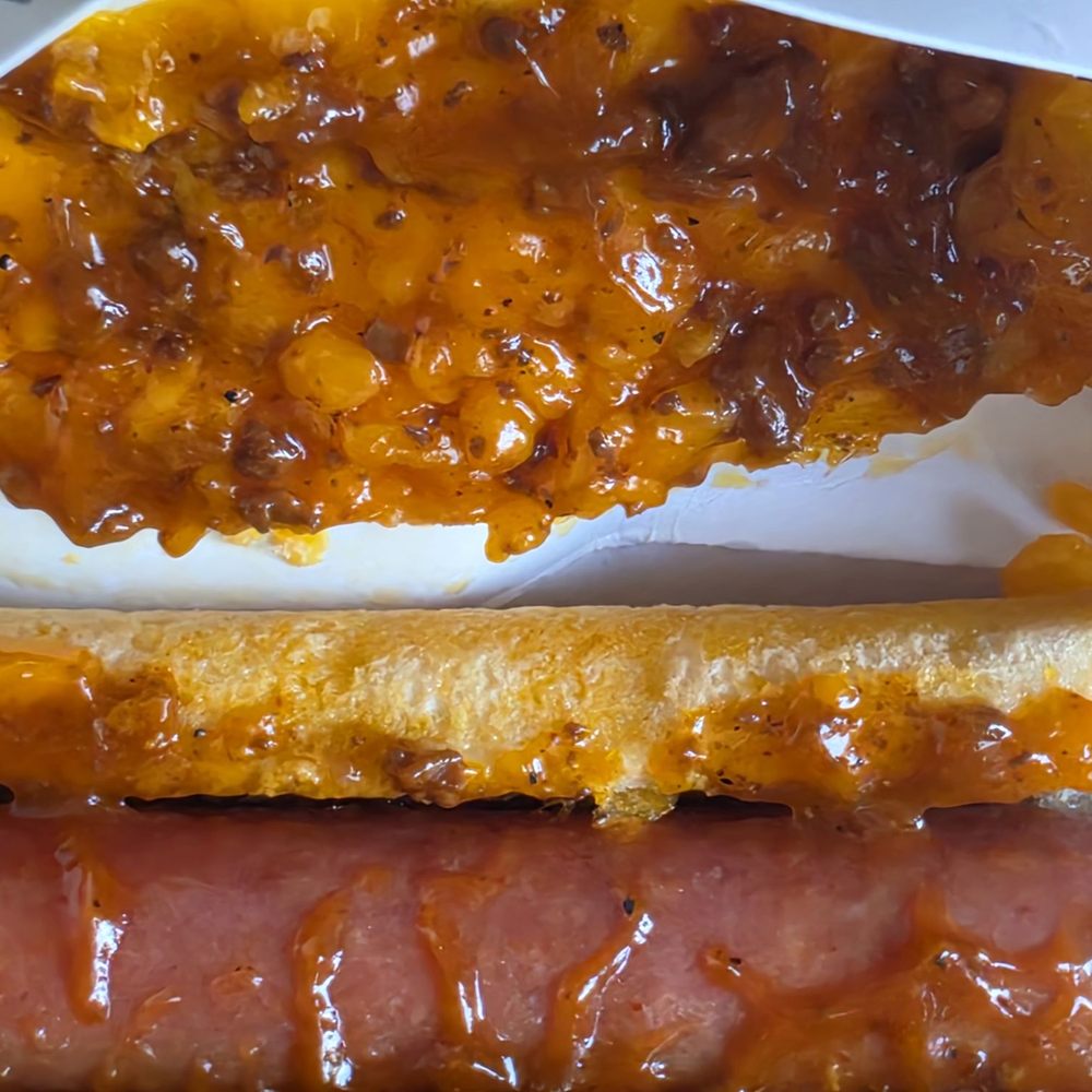 Wienerschnitzel - Container has the chili and cheese stuck on the top and hot dog in bun on the bottom - Hot Dogs Near Me - Alhambra, California Wienerschnitzel - Container has the chili and cheese stuck on the top and hot dog in bun on the bottom - Hot Dogs Near Me - Alhambra, California
