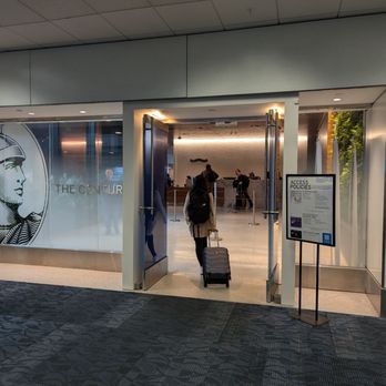 American Express Centurion Lounge - Outside the American Express Centurion Lounge storefront and entrance next to Gate E11 at Hartsfield Atlanta. Concourse E. - Airport Lounges Near Me - Atlanta, Georgia