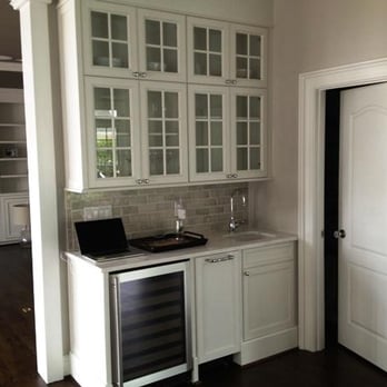 Triangle Cabinets & Renovations - Glass-paned wall cabinets with under-counter wine fridge and bar sink, (Preston) Cary, NC - General Contractors Near Me - Raleigh, North Carolina