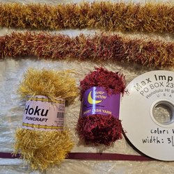 Which yarn Lei looks better? Top one has more sparkle and is thicker from the gold yarn. Bottom one has more maroon and isn't as thick.