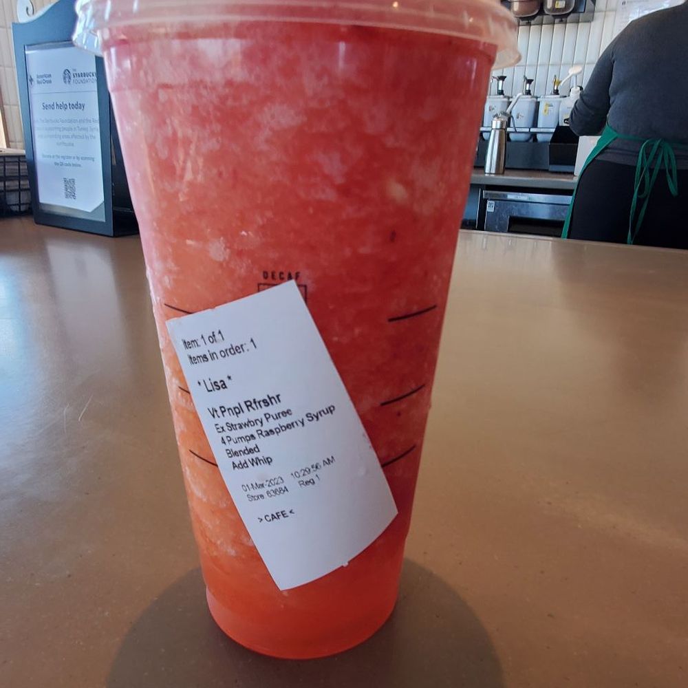 Starbucks - Venti pineapple passion fruit with 4 pumps raspberry,extra strawberry puree,blended with whipped cream - Coffee & Tea Near Me - Guthrie, Oklahoma