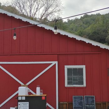 TwiningVine Winery - a man standing in the doorway of a red barn - Wineries Near Me - Castro Valley, California