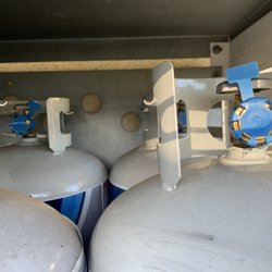 Shell - Full, unused propane tanks have the blue one time use tear off covers as seen in this photo