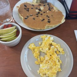 Blueberry pancake, eggs and fruit Blueberry pancake, eggs and fruit