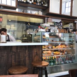 BlissHIVE Bakery Café - Interior bakery selection with bar seating available
