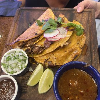 La Más Querida - Quesabirria (3) Slow cooked beef in a quesadilla with cheese, cilantro, onion, and salsa with a side of consome for dunking. - Mexican Near Me - San Jose, California La Más Querida - Quesabirria (3) Slow cooked beef in a quesadilla with cheese, cilantro, onion, and salsa with a side of consome for dunking. - Mexican Near Me - San Jose, California