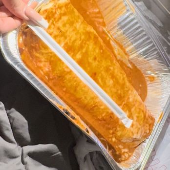 Los Tres Hermanos Express - a person holding a tray of food - Mexican Near Me - Sylmar, California Los Tres Hermanos Express - a person holding a tray of food - Mexican Near Me - Sylmar, California