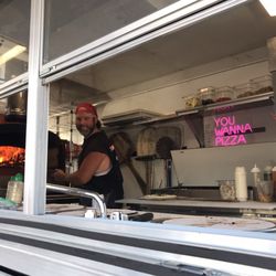 Shore Fire Pizza - The chef in action. Josh's open fire pizza oven in his own pizza truck.
