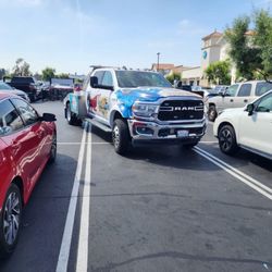 Bob & Dave's Towing - Took up 3 spots with driver no where to be found. Bunch of incompetent clowns