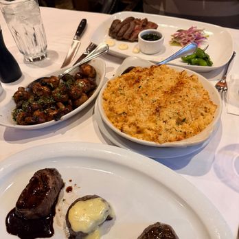 Lou & Mickey's - Top to Bottom: 6oz A5 New York, Sauteed Mushrooms, Mac and Cheese, and Filet Medallions "Three Ways" - Steakhouses Near Me - San Diego, California