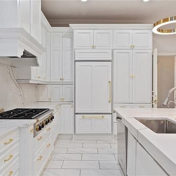 Good Guy Builders - A stunning all white kitchen with custom finishes, paneled refrigerators, and high end craftsmanship. - General Contractors Near Me