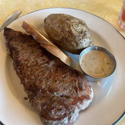 Opera House Brewery & Grill - Special 14oz ny strip with bourbon sauce with baked potato and garlic bread