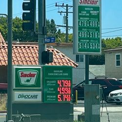 76 - These are the easily visible signs. Another "Full Service" price list was tucked down low at the opposite sidewalk.