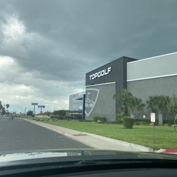 Topgolf - the front of a building with a sign on it - Golf Near Me - Pharr, Texas Topgolf - the front of a building with a sign on it - Golf Near Me - Pharr, Texas
