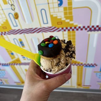 Yonutz - a hand holding a cup of ice cream - Donuts Near Me - Yukon, Oklahoma