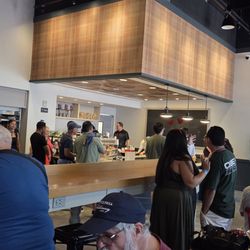 Bunch of staff behind the counter. Little food going out...