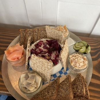 Broder - Salmon lox, pickled herring, smoked trout, (I subbed out the shrimp salad for more smoked trout), pickles and radicchio. - Scandinavian Near Me