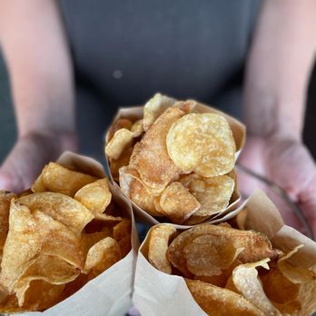 Dip Shack - a person holding a plate of chips - Food Trucks Near Me Dip Shack - a person holding a plate of chips - Food Trucks Near Me