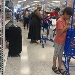 Ross Dress for Less - Line wraps around three sides of the store and doesn't move. Waste of time.