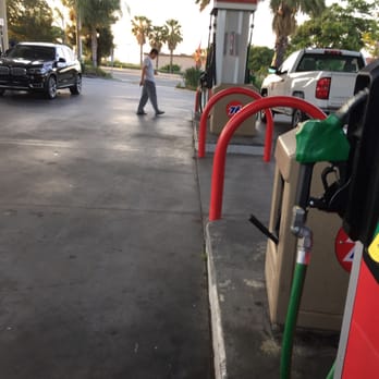 Circle K - a gas pump and a person walking in a parking lot - Gas Stations Near Me - Corona, California Circle K - a gas pump and a person walking in a parking lot - Gas Stations Near Me - Corona, California
