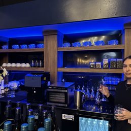 a man and a woman standing in front of a bar a man and a woman standing in front of a bar