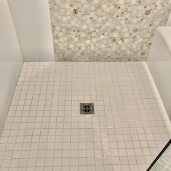 Marble Specialist - This is the after!  The white tile came back to original luster and they cleaned all the walls too!! - Refinishing Services Near Me