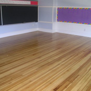 Flawless Floors - a room with a blackboard in the corner - Flooring Near Me