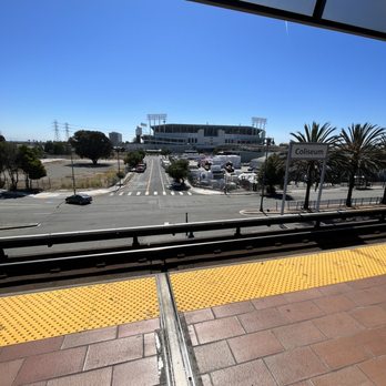 BART - Coliseum Station - Coliseum in background of station - Train Stations Near Me - Oakland, California