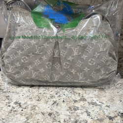 Oak Neck Cleaners - Denim LV bag after cleaning at Oak Neck Cleaners. The denim had actually yellowed & after cleaning it is ready to wear again!