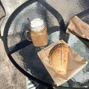 Empanada World Café - Chicken empanada on the right (coffee was made at home) - Empanadas Near Me - Tampa, Florida Empanada World Café - Chicken empanada on the right (coffee was made at home) - Empanadas Near Me - Tampa, Florida