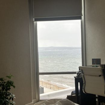 Delamar - The view is industrial/bay view. The water is quite lovely but this small window is all you get when you request a "bay view". - Hotels Near Me - Traverse City, Michigan