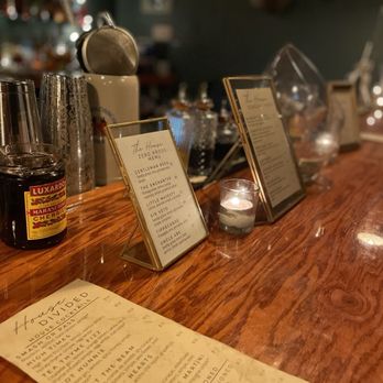 House Divided - a bar with a menu and bottles of liquor - Cocktail Bars Near Me - Roseville, California