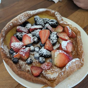 Plums Cafe - Dutch Baby = a table pleaser (berries are an additional $6) - Breakfast & Brunch Near Me - Costa Mesa, California Plums Cafe - Dutch Baby = a table pleaser (berries are an additional $6) - Breakfast & Brunch Near Me - Costa Mesa, California