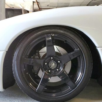 Action Auto - Now look at the left side.  You can see this side is so low the tire is almost scraping the fender liner! - Auto Repair Near Me - Cypress, California