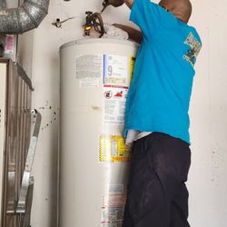 All Star Plumbing - Twan of All Star Plumbing removing my old water heater.