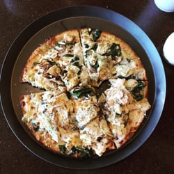 Palio's Pizza Cafe - Gluten free thin crust with olive oil base, chicken, mushroom, artichoke, spinach, oregano, and cheddar
