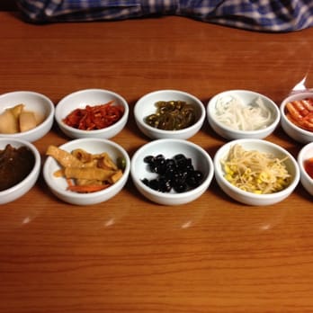 Dong Yang Market - Cabbage kimchi on top right. Radish kimchi in bottom right. Black beans in center bottom. Fish cake on bottom, second from left. - Grocery Near Me - Lexington, Kentucky