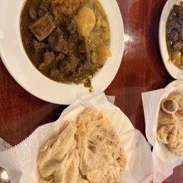 Curry goat , pumpkin and aloo curry with roti Curry goat , pumpkin and aloo curry with roti
