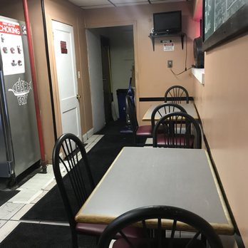 Piro's Pizza - a table and chairs in a restaurant - Pizza Near Me - Niagara Falls, New York