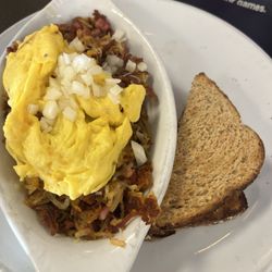 The Breakfast SPOT - Vaquero: eggs, hash browns with assorted meats. Toast on the side