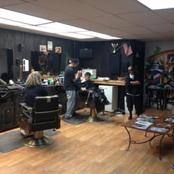 Tumi's Allstar Barbershop - Carlos, one of the lead hair artists, in action.