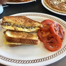 Egg sausage cheese melt with grilled tomato