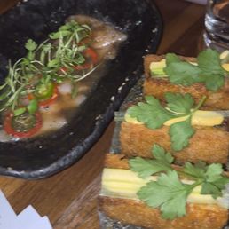 Lobster cakes and fish garnishes with Jalapeños and chili Lobster cakes and fish garnishes with Jalapeños and chili