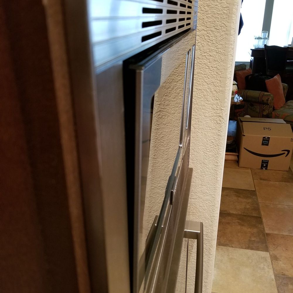 Rikman Services - VIEW OF MICROWAVE LEANING FORWARD 6 DEGREES. - Electricians Near Me - Conroe, Texas