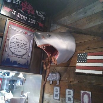 Sharko's BBQ - A shark messily eating smoked sausages at Sharko's BBQ - Barbeque Near Me - Naperville, Illinois Sharko's BBQ - A shark messily eating smoked sausages at Sharko's BBQ - Barbeque Near Me - Naperville, Illinois