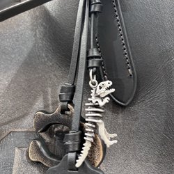 The Coach Coffee Shop - Haha. Purse charm of a dinosaur skeleton, Halloween